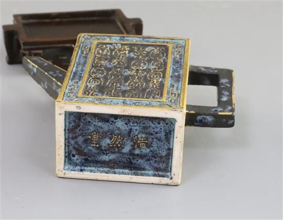 A Chinese enamelled biscuit Forty Shou miniature wine pot, 19th/20th century, H. 10cm, wood stand, fitted box